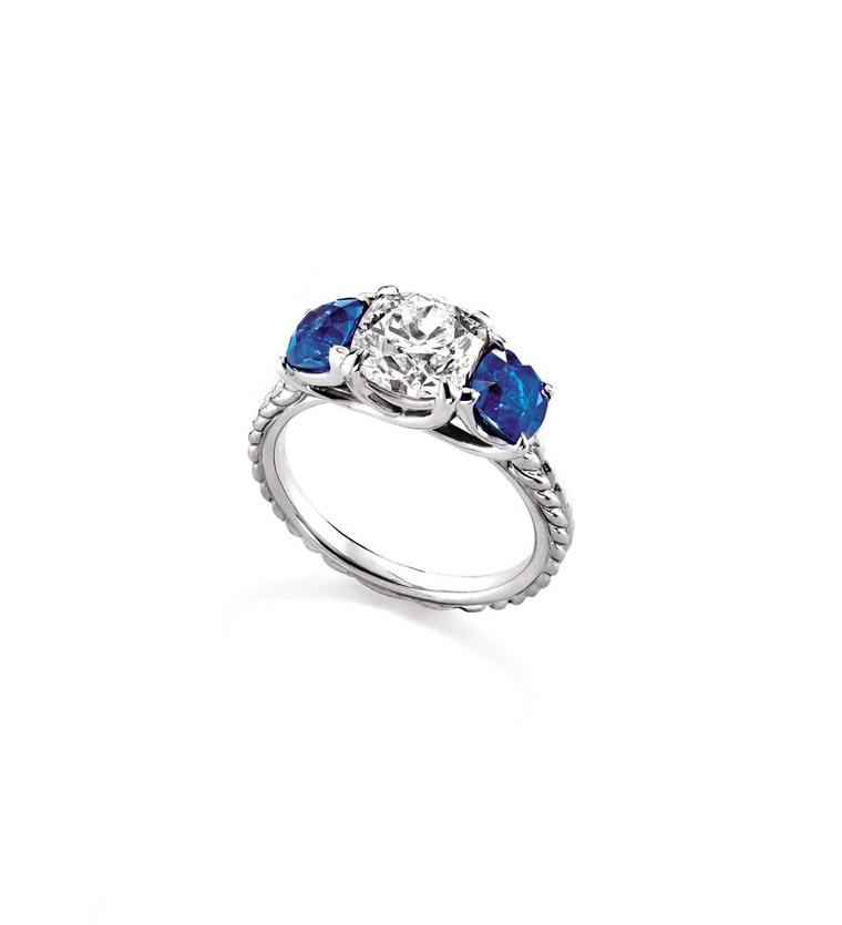 David Yurman Classic three stone engagement ring in platinum set with a diamond and two sapphires.